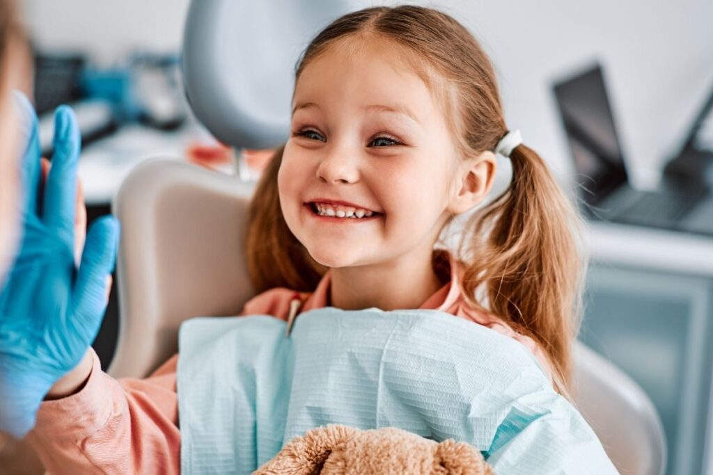 happy kid with gapped teeth at orthodontic checkup